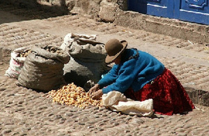 Woman selling potatoes, Pisac, Peru