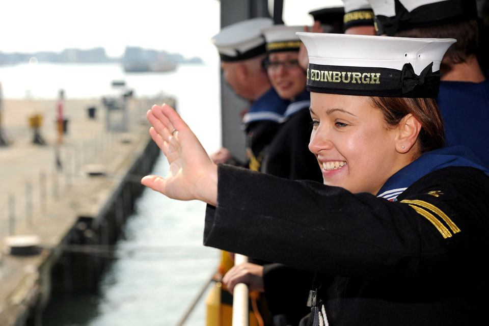 Leading Logistician Gemma Raybould waves to loved ones ashore
