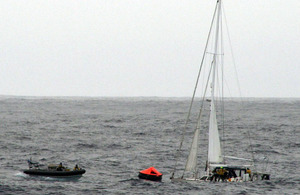 A rigid inflatable boat from HMS Clyde approaches the stricken yacht