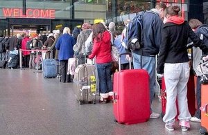 Passengers queuing in Heathrow Airport