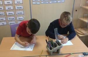Image shows pupils working on their flood designs