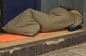 Man sleeping rough in a doorway