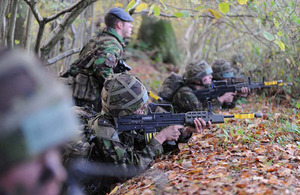 Corporal Robbie O'Neil watches over recruits as they take part in the final assault of Exercise Blue Warrior