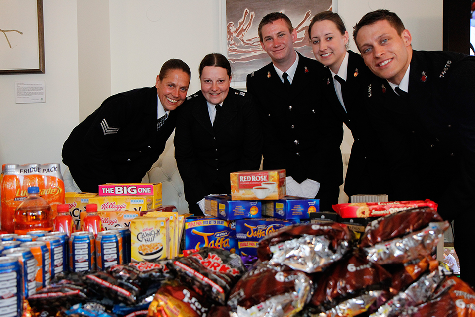 Metropolitan Police present the consulate with British treats to sell for charity on behalf of Jack's PACK.