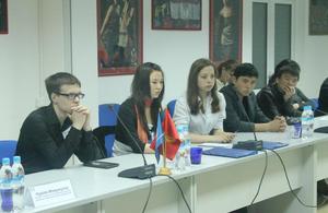 School pupils and university students taking part in the round table discussion
