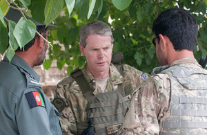 Lieutenant General Adrian Bradshaw speaks with members of the Afghan National Security Forces