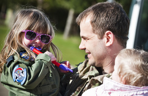 Flight Lieutenant Mark Longstaffe is welcomed back to RAF Marham by his family [Picture: Corporal Paul Oldfield RAF, Crown copyright]