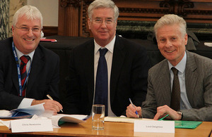 Lord Deighton and Michael Fallon signing the initiative with Chris Newsome from Anglia water