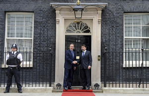 Prime Minister David Cameron and President János Áder of Hungary, shaking hands outside 10 Downing Street.
