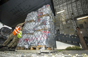 An RAF C17 aircraft is loaded with aid from the British people for people affected by the earthquake in Nepal