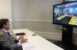 International Trade Minister Greg Hands, accompanied by Peruvian Ambassador to the UK Claudio de la Puente Ribeyro, signs the arrangement via video-link with the Lima 2019 organising committee.