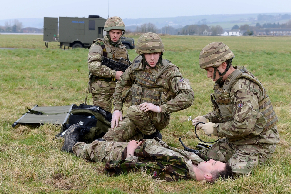 Commandos providing first aid to a battlefield 'casualty'