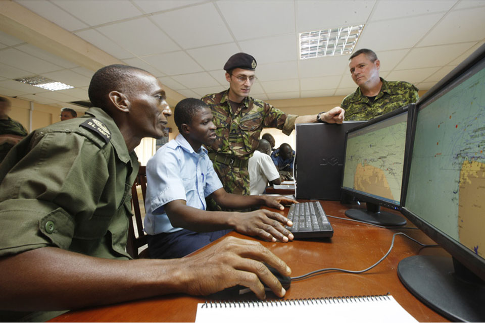 Overseen by Royal Navy Lieutenant Commander Edward Carpenter and Canadian Navy Chief Petty Officer Second Class Steve Smith, Sierra Leone navy personnel monitor a radar tracking system, watching for illegal maritime movements including drug trafficking, o