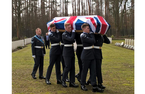 Members of the RAF Queen's Colour Sqn Bear Sgt Lawson's coffin. Crown Copyright. All rights reserved