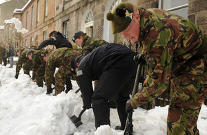 Military personnel, including members of The Royal Regiment of Scotland, helping to clear snow to allow access to Edinburgh's 'Sick Kids' Hospital