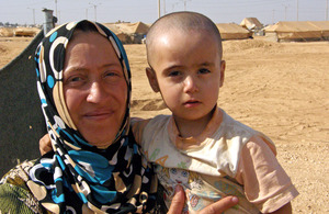 A mother and her 2 year old daughter at the Za’atari refugee camp in Jordan