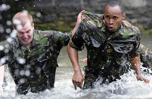 Able Seaman Fasuba (right) during Exercise Daring Leap, one of the three extended exercises in the course of his 10-week initial naval training course