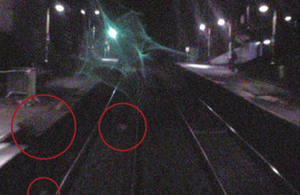 Displaced coping stones and debris on the track (circled) recorded by forward facing CCTV on the passenger train (image courtesy of Northern Rail)