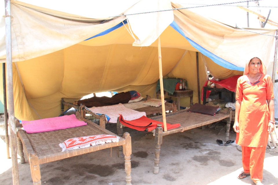 The way we used to live: Sabiha stands outside the tent she soon hopes to leave for more permanent accommodation. Picture: Vicki Francis/DFID