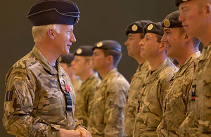 Air Chief Marshal Sir Stephen Dalton chats with RAF police personnel on their return from Afghanistan