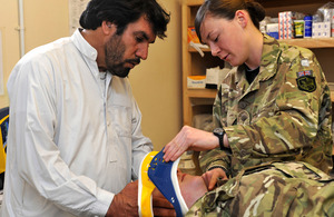 Private Megan Paynter training an Afghan nurse