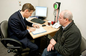 GP consulting a patient