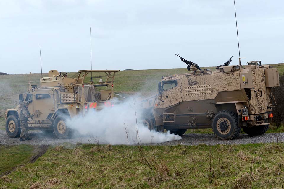 Soldiers practise extracting an immobilised Foxhound vehicle