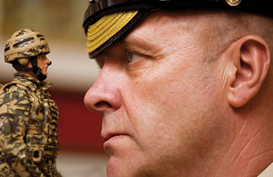 Garrison Sergeant Major Bill Mott with one of the HM Armed Forces infantryman action figures to which he has lent his voice