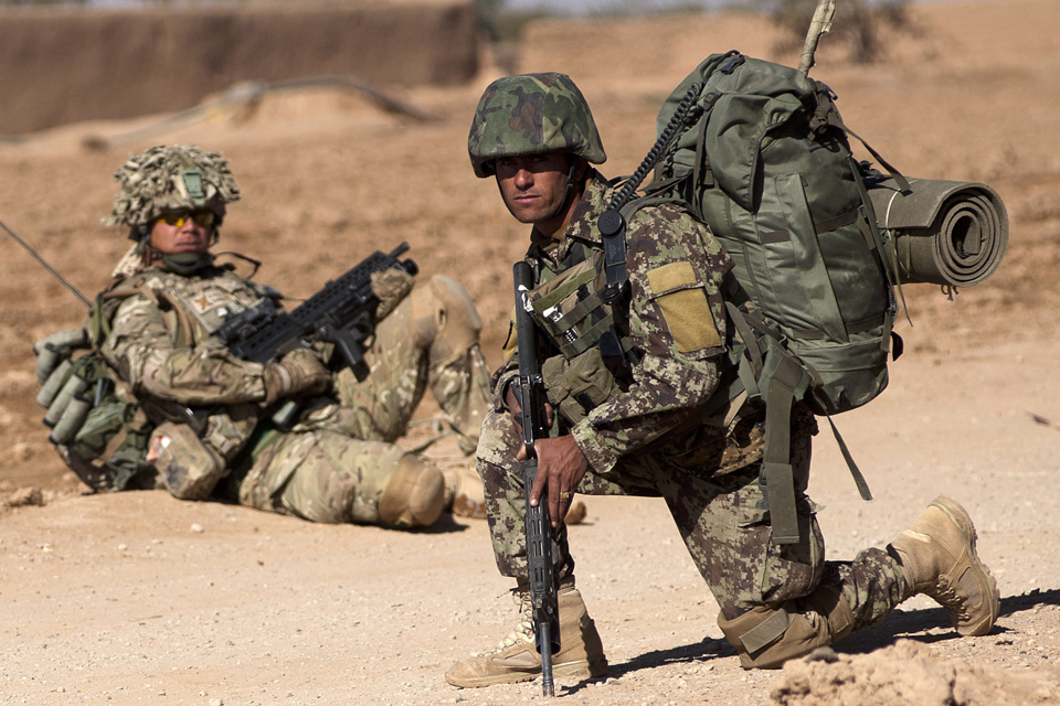 A 1 SCOTS soldier and an Afghan warrior 