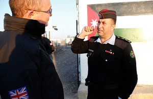 Former British police officer Stephen Boddy speaks with Lieutenant Ahmad Mjalli of the Jordanian Community Police team in the Za’atari refugee camp. Photo: DFID / Russell Watkins