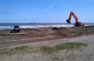 Sand is dredged from the seabed to replace beach levels lost to the sea over the winter