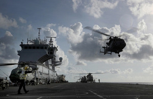 A Wildcat and Merlin Mk 3 Helicopters from 845 and 847 Naval Air Squadron, of the Commando Helicopter Force (CHF) conduct deck landing and winching practice.