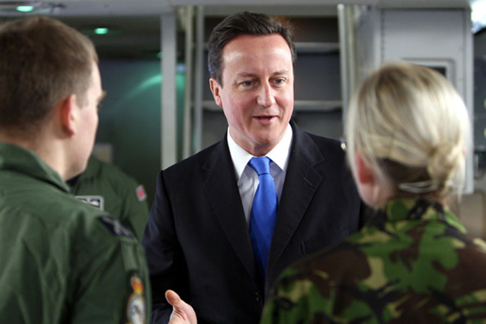 Prime Minister David Cameron talking to RAF personnel on the flight deck of the RAF's newest C-17 transport aircraft