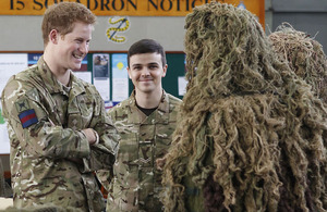 Prince Harry talking to RAF Regiment snipers in ghillie suits during his visit to RAF Honington [Picture: Corporal Jim MacDonald RAF, Crown Copyright/MOD 2012]