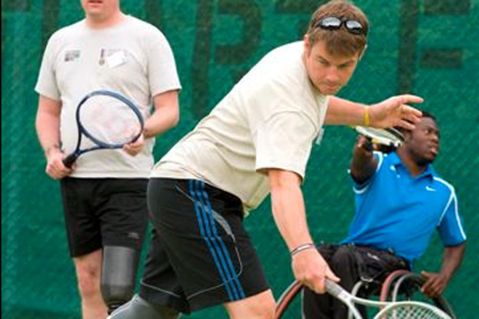 An injured serviceman playing tennis at the launch of the Battle Back tennis initiative