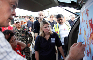International Development Secretary Justine Greening receives a briefing during a visit to Tacloban in the aftermath of Typhoon Haiyan, November 2013.