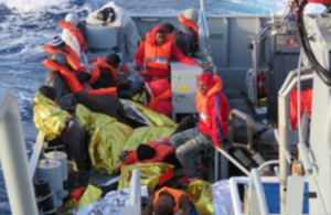 Migrants on board HMC Protector after being rescued by Border Force officials