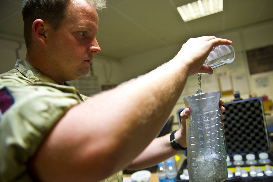 Flight Sergeant Dan Biggs conducts bacteriological water testing 
