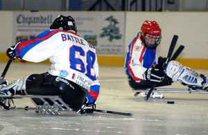 Players from the Battle Back Bisons, an ice sledge hockey team made up from injured military personnel, in action at the Planet Ice Arena in Basingstoke