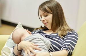 A mother breastfeeding her baby.