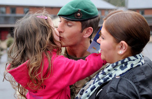 A Royal Marine kisses his daughter on his return to the UK from Afghanistan [Picture: Leading Airman (Photographer) Caroline Davies, Crown Copyright/MOD 2013]