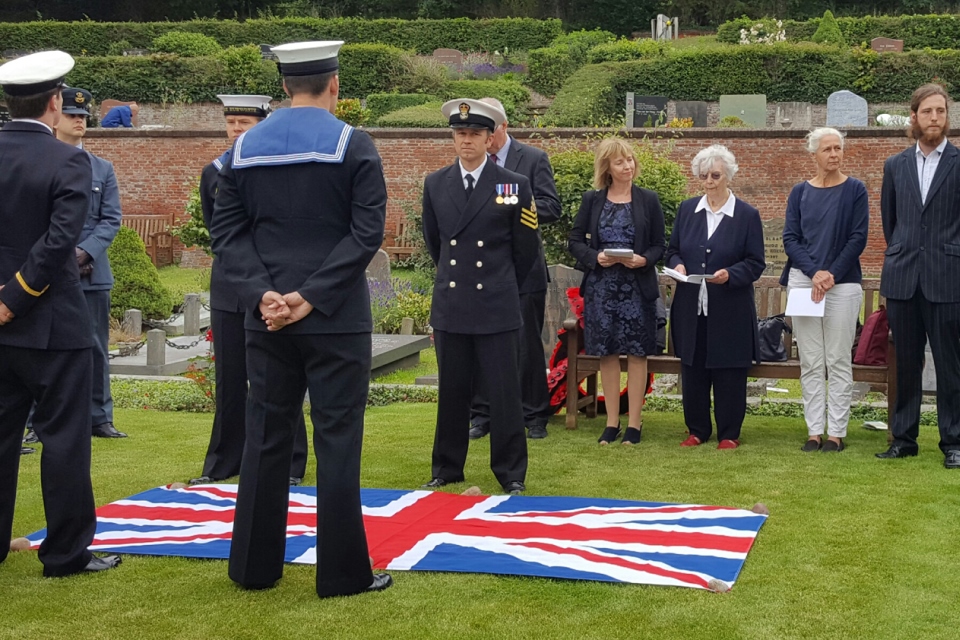 Family members and representatives from Ship's Company attend the service of AB Dobson. Crown Copyright. All rights reserved.