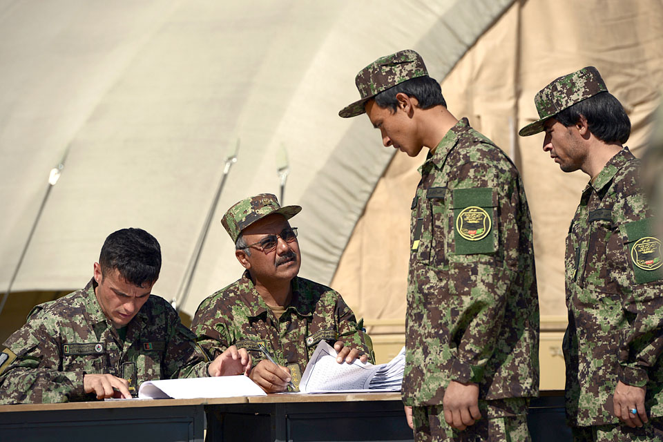 An officer cadet has his details checked during enrolment