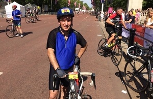 Wales Office Minister Alun Cairns pictured crossing the finishing line