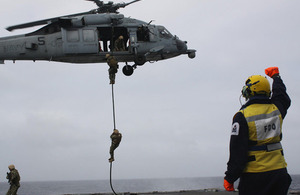 United States Marines fast-rope onto HMS Dragon's deck during an exercise [Picture: Crown copyright]