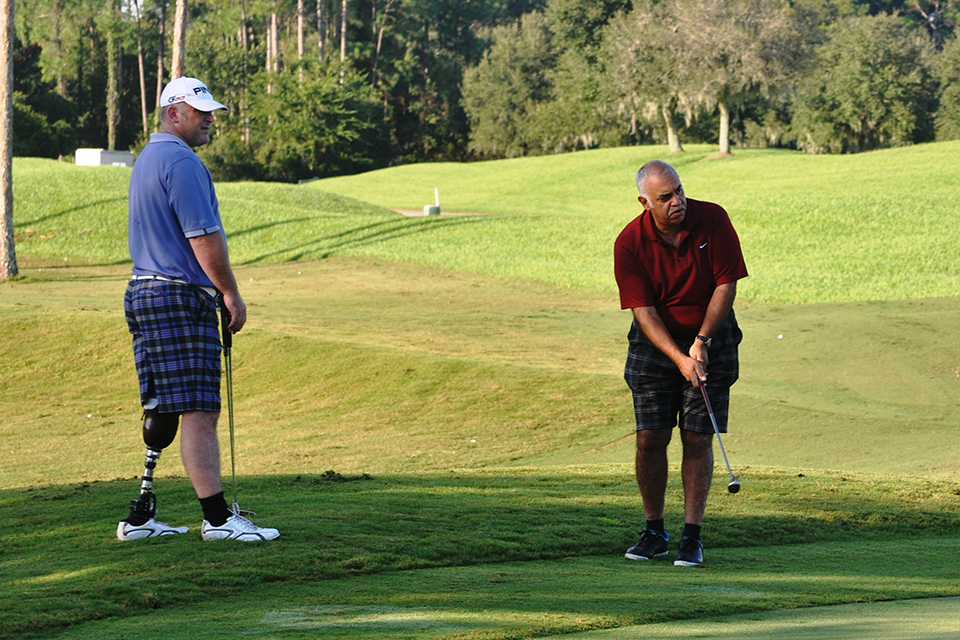 Military men help injured comrades swing back into action