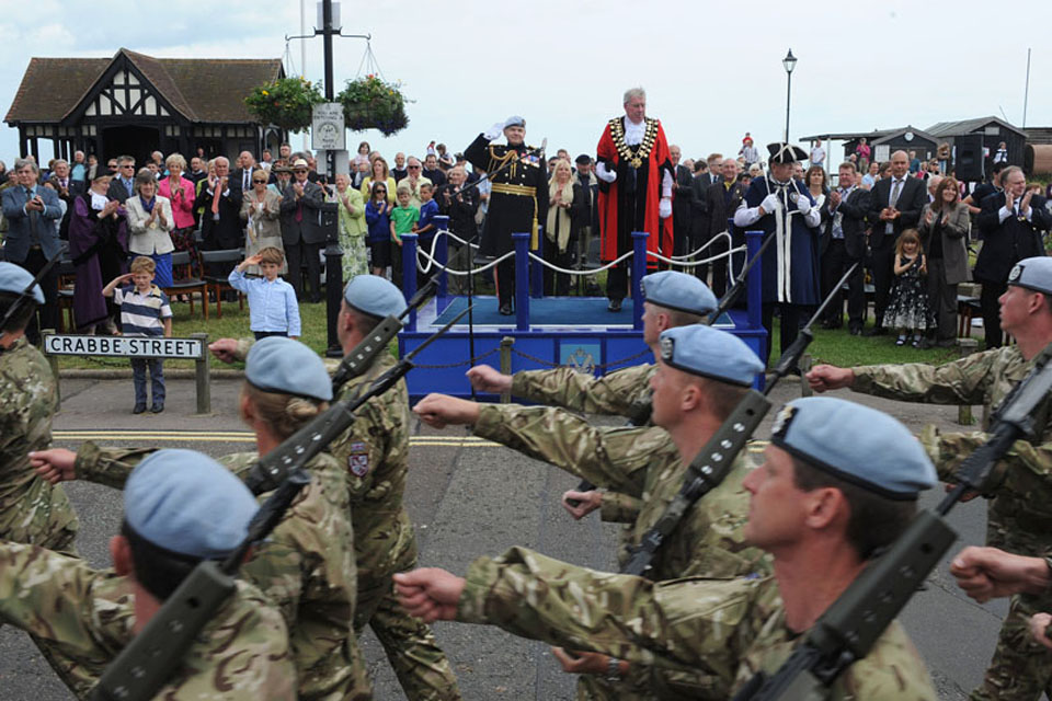The Mayor of Aldeburgh, Councillor Peter Cox, and Lieutenant General Sir Gary Coward take the salute as soldiers from 3 Regiment Army Air Corps march through the town of Aldeburgh 