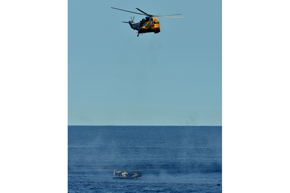 Sea King helicopter hovers over suspect speedboat