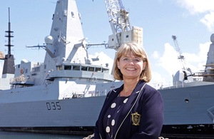 Defence Minister Harriett Baldwin in front of Type 45 destroyer HMS Dragon. Crown copyright.