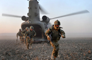 Soldiers dismount from a Chinook helicopter